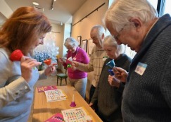 A group enjoying a craft activity together at a table