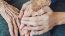 Close-up of hands held together in comfort
